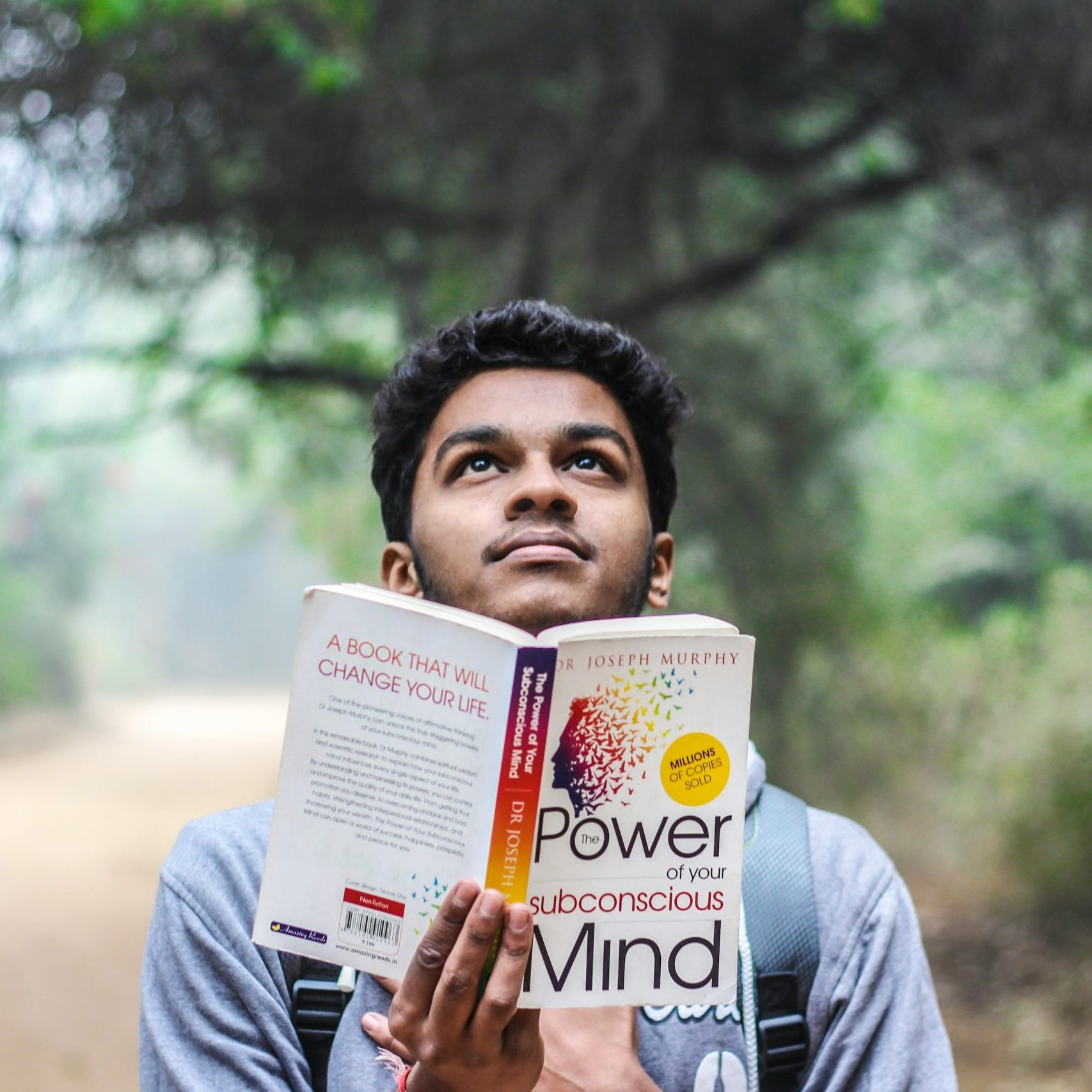 Man reading textbook.